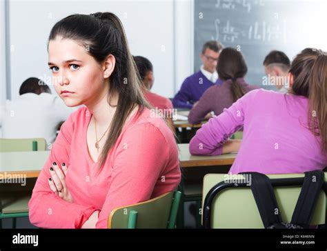 ﻿lonely Student Sitting Away From Classmates And Feeling Depressed