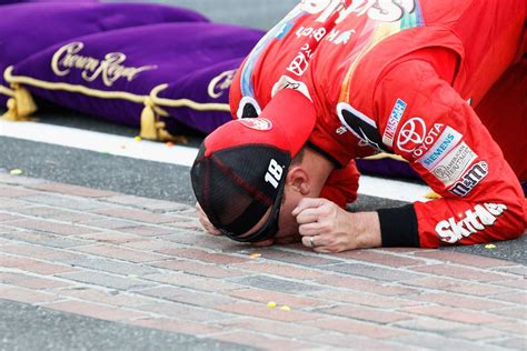Kyle Busch Kissing The Bricks At Indy Official Site Of Nascar