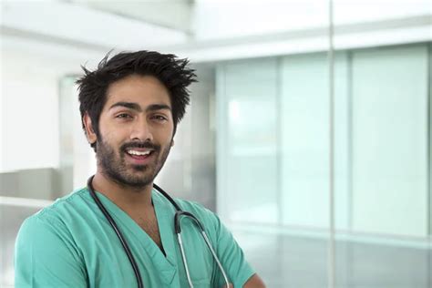 Male Indian Doctor Wearing A Green Scrubs Stock Image Everypixel