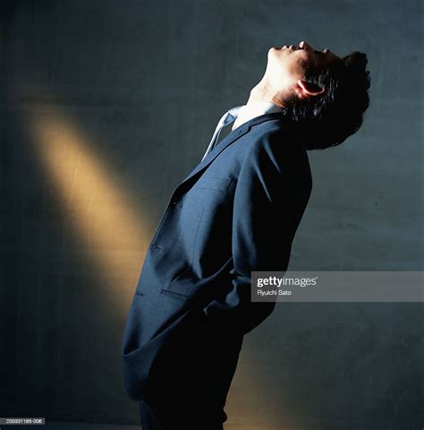 Businessman Leaning Backwards Side View High Res Stock Photo Getty Images