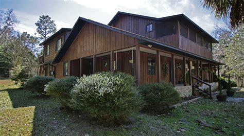 A large family room with a panoramic view of the woods could possibly. Rustic and Luxurious | Central Florida's Log Cabin Homes