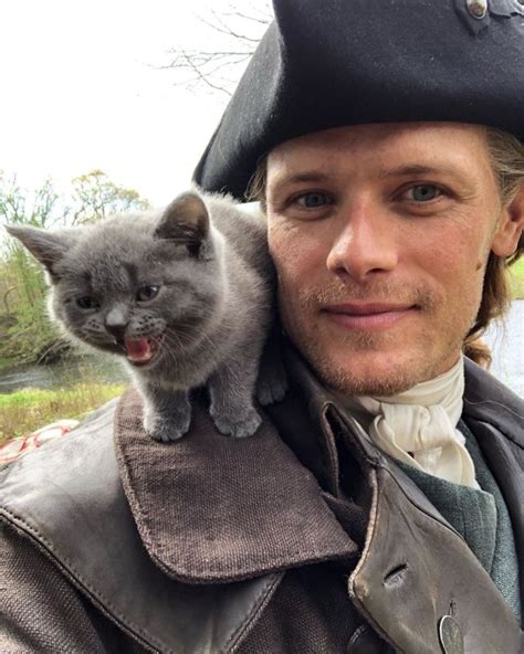 New Pics Of Sam Heughan And The Cat Playing Adso Outlander Online