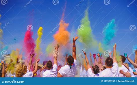 Bright People Celebrate The Holiday Holi A Group Of People Throw Paint