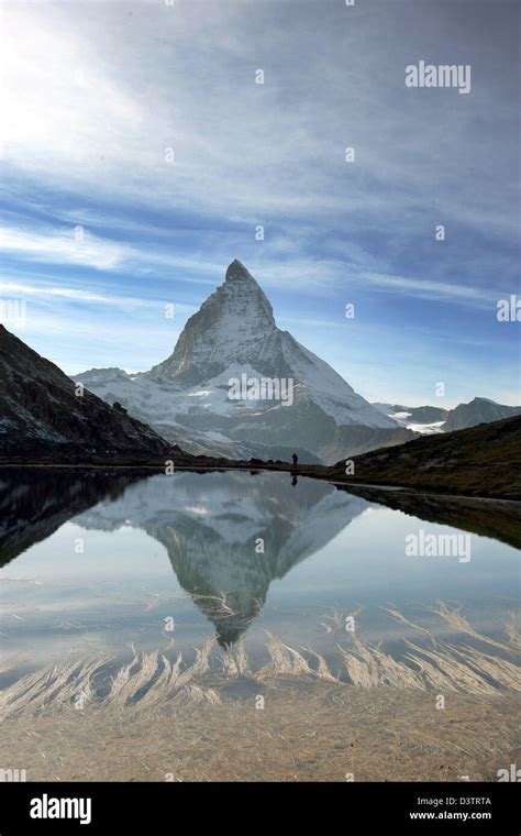 The Matterhorn Mountain Reflects In Lake Riffelsee Above Zermatt In