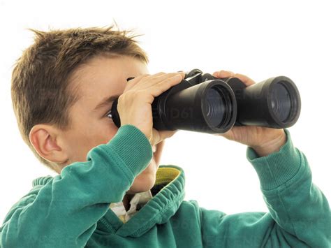 Boy Looking Through Binoculars Stock Photo