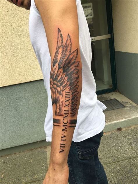 Roman Numerals Arm Tattoo Fallen Angel Tattoo Angel Wing Man With White Top Jeans Cool Forearm