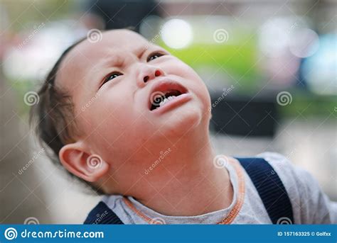 Angry Caucasian Little Baby Boy Crying And Looking Up Stock Image