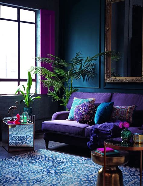 The purple rug provides a grounding for the scheme that boosts the impact of the pale walls and sofas. How to Decorate with Pantone Color of the Year 2018 - Ultra Violet | Homelovr
