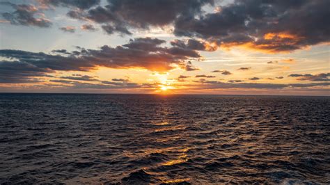 Download Wallpaper 3840x2160 Sea Waves Clouds Sky Horizon Sunset