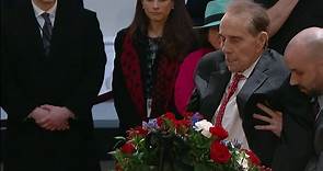 Bob Dole salutes George HW Bush's casket