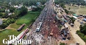 Drone footage shows authorities clearing tracks after deadly train crash in India