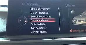 How to access the owners manual in the BMW iDrive Houston Texas