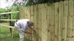 Wood privacy fence picket installation