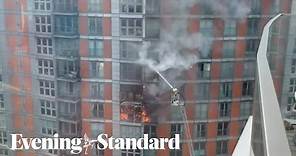 London fire: Blaze engulfs several floors of tower block near Canary Wharf