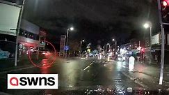 Moment car speeds through T-junction smashing into a building