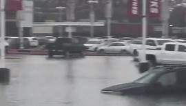 'Not again!' Flash flooding submerges roads and cars in Beaumont, Texas.