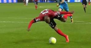Guingamp's Jimmy Briand tries to score off-balance against rennes fc