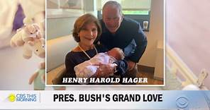 George W. Bush shows pictures of grandson