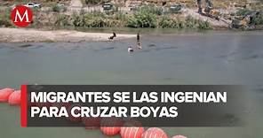 Migrantes evaden muro flotante puesto en el Río Bravo