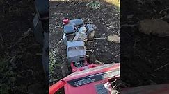 Troy Bilt Bronco CRT Counter Rotating Tines roto tiller tilling the garden