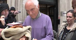 Screen icon Terence Stamp signs autographs for fans outside BBC