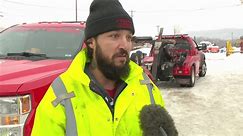Tow trucks working to help drivers stranded on roads