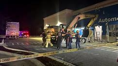 Stolen excavator crashes into Walmart store ((Credit: Gainesville Police Department via Storyful))