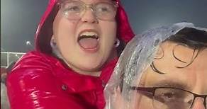 Swiftie Dad with Daughter singing in the rain at Taylor Swift Eras Tour