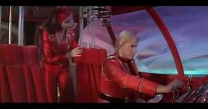 Princess Aura teaches Flash Gordon how to pilot a spaceship