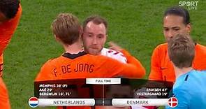 The Dutch and Danish players embrace Christian Eriksen after his brilliant return for Denmark.
