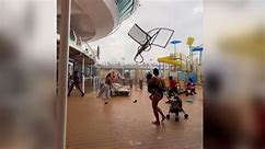 Watch cruise passengers flee flying lounge chairs, debris as storm hits