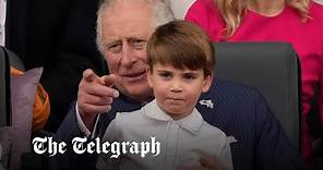 Mischievous Prince Louis sits on Prince Charles' lap during Queen's Platinum Jubilee Pageant