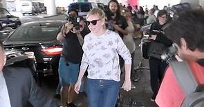 Kirsten Dunst lands in LAX wearing a cute floral sweater