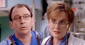 Laura Innes and her real life husband David Brisbin in the same scene on ER