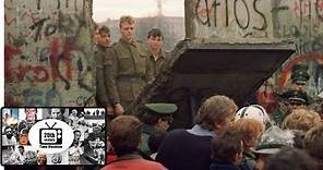 The Berlin Wall Falls in 1989. Footage of the Wall Being Torn Down.