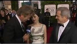 Mel Gibson and Rosalind Ross chatting on the Golden Globes Red Carpet