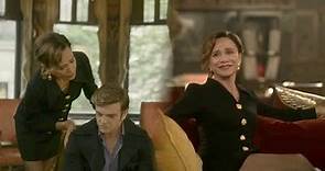Lena Olin wearing a short skirt, pantyhose and boots on the TV series Hunters.