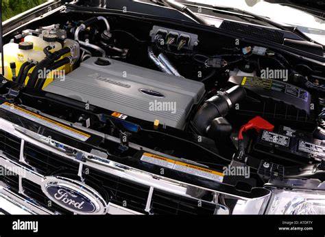 Engine bay of a 07 Ford Escape Hybrid, highlighting the hybrid powertrain components.