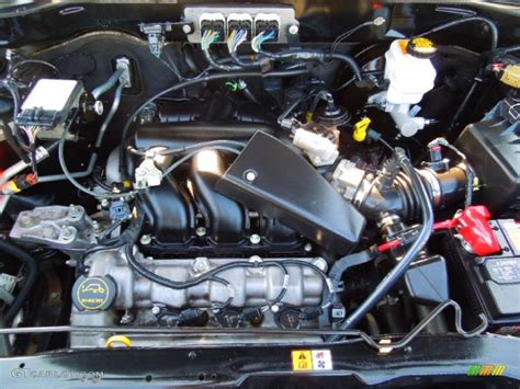 Engine bay of a 2008 Ford Escape XLT highlighting its mechanical components