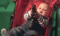 Baby with a Gun Meme Real