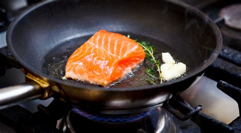 Sautéing fish in a pan