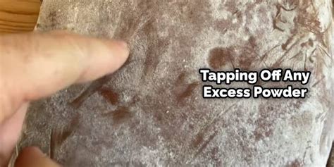 Tapping off excess powder