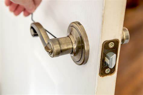 Tighten screws on door handle