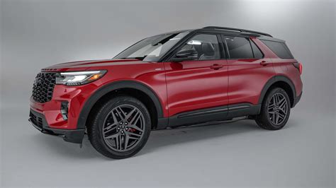 Red Ford Explorer ST showcasing its sporty stance and aggressive front grille