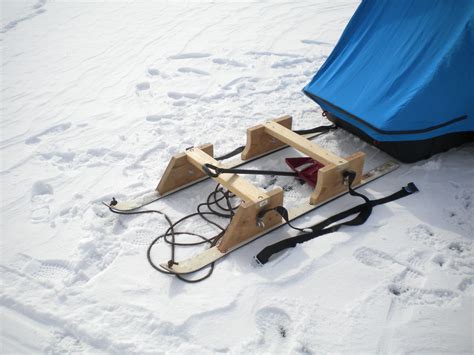 sled or ice shanty for tip down ice fishing