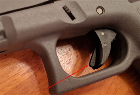 Trigger safety tab mechanism